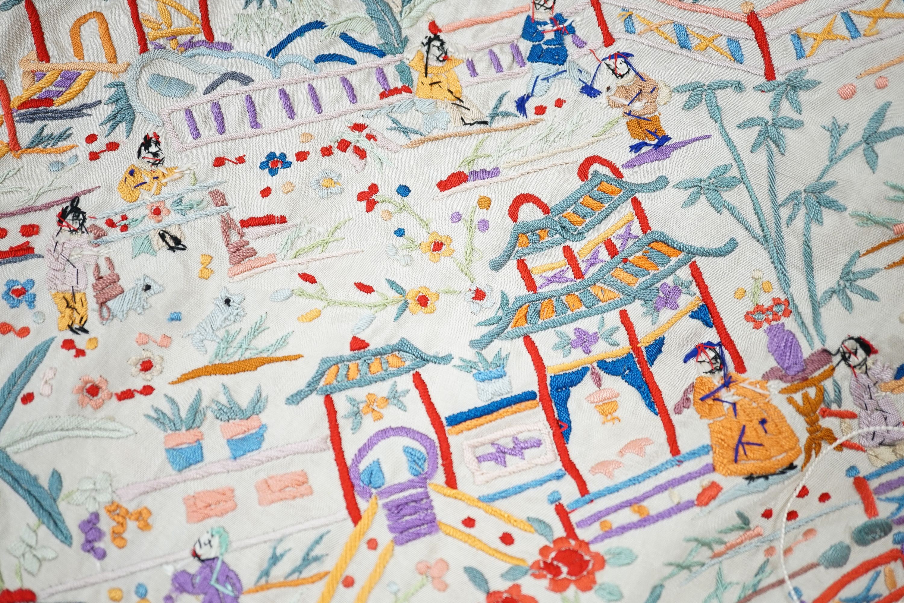 A Chinese cream silk shawl with fine multi coloured all over embroidery depicting figurative scenes and animals